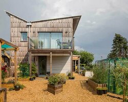 inverted gable roof unfolds on top of mole architects’ passivhaus in the UK
