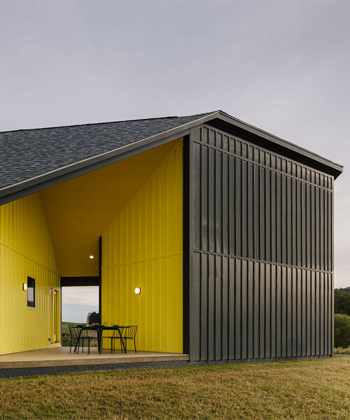 a striking yellow void punctuates scalar architecture's farm-like residence in the berkshires