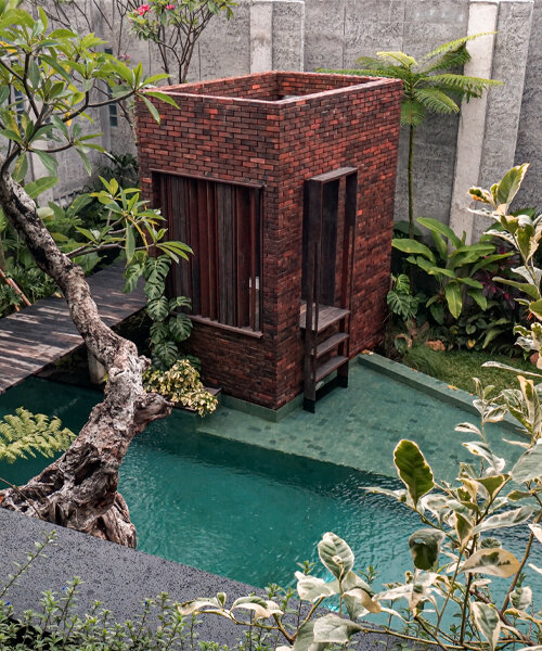 grass, stones, shrubs, and trees envelop studioRK's vibrant OHIO house in indonesia