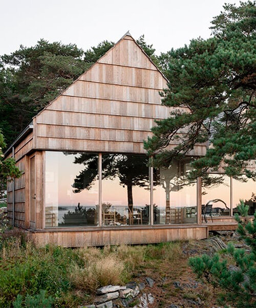 a house made of oak plank offcuts stands on the south coast of norway