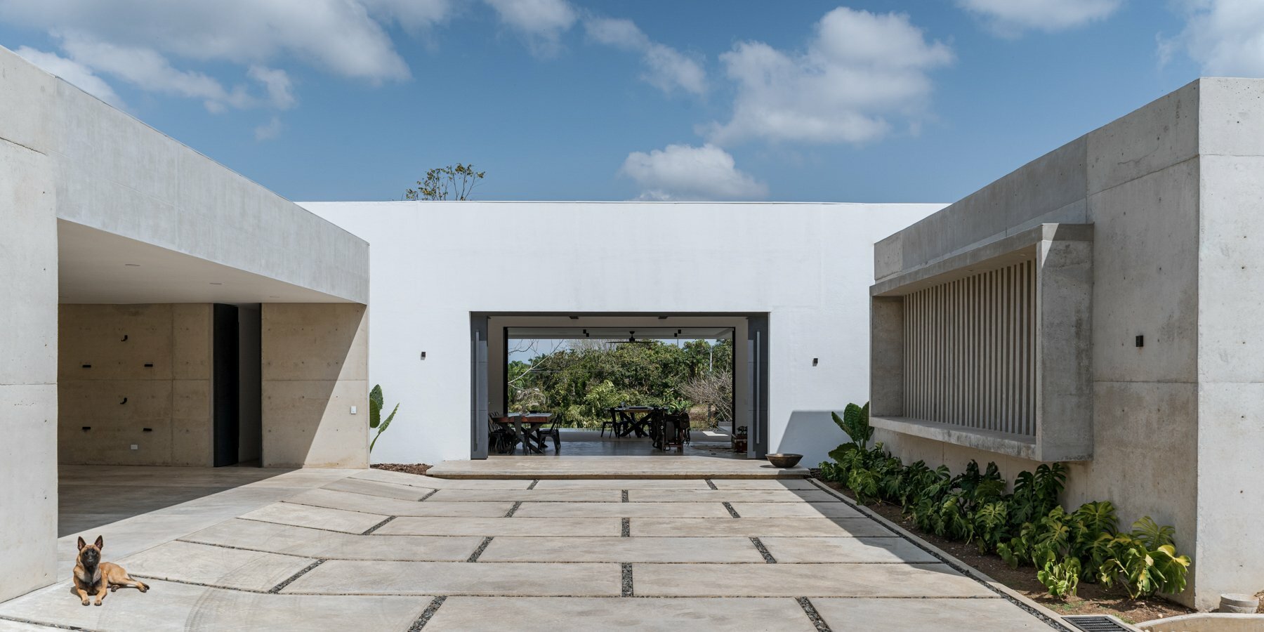 concrete residence expands cantilevered volumes in rural colombia