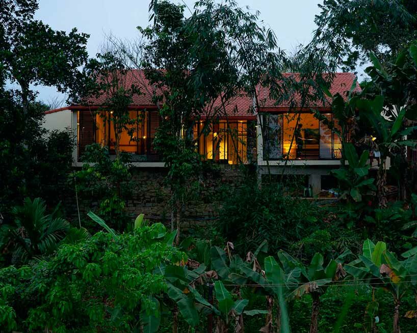 overlapping shingle roofs shield multileveled tien cam house in vietnam