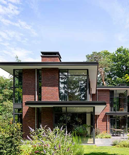 red brick facade and steel fascias form villa trompenberg in the netherlands