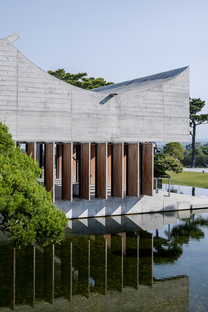 curved concrete plates adorn 'watermoon tea house' in taiwan