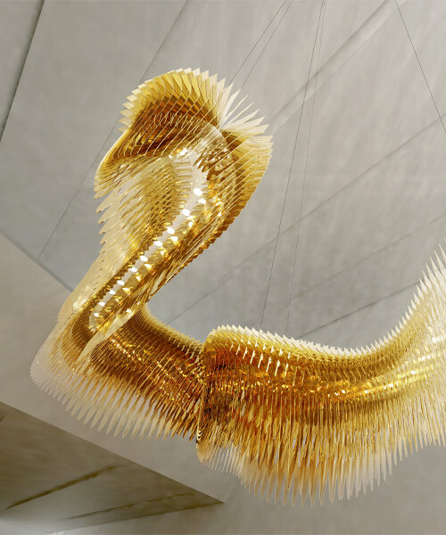 new zaha hadid x SLAMP lighting sculpture undulates and warps across space