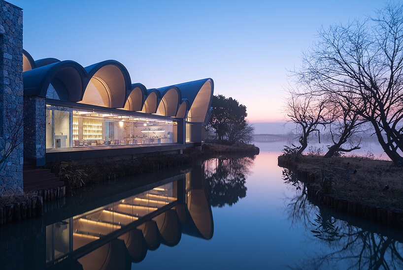 GOA and WJ studio's 'boatyard hotel' in china unfolds as a series of arched canopies