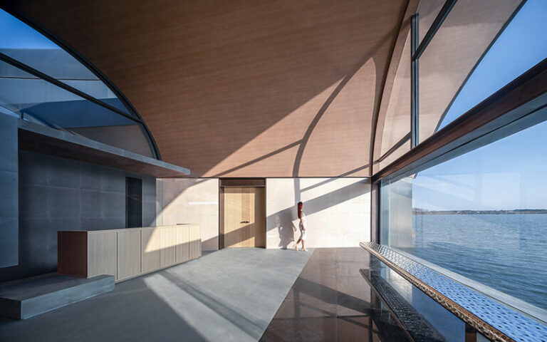 the 'boatyard hotel' in china unfolds as a series of arched canopies