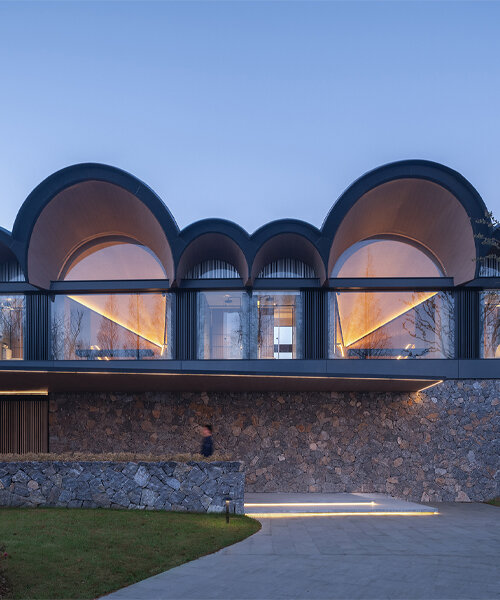 GOA and WJ studio's 'boatyard hotel' in china unfolds as a series of arched canopies