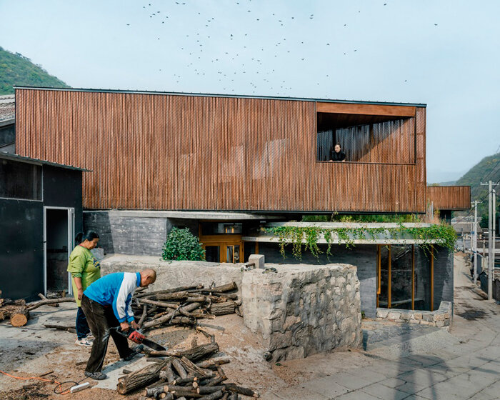 bending wooden bridge by DL atelier hovers above historical chinese fortress