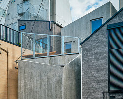 slanted lines and staggered floors create alternative spaces inside tokyo's diagonal house
