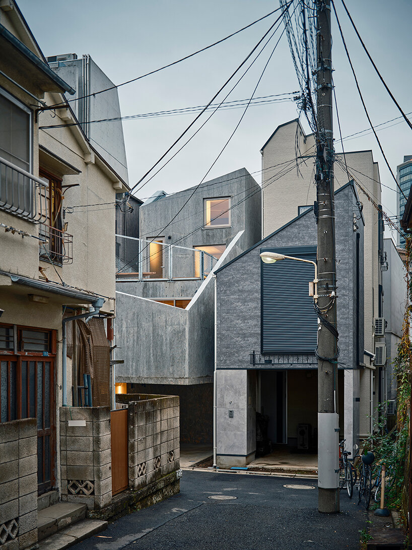 slanted lines and staggered floors create alternative spaces inside tokyo's diagonal house