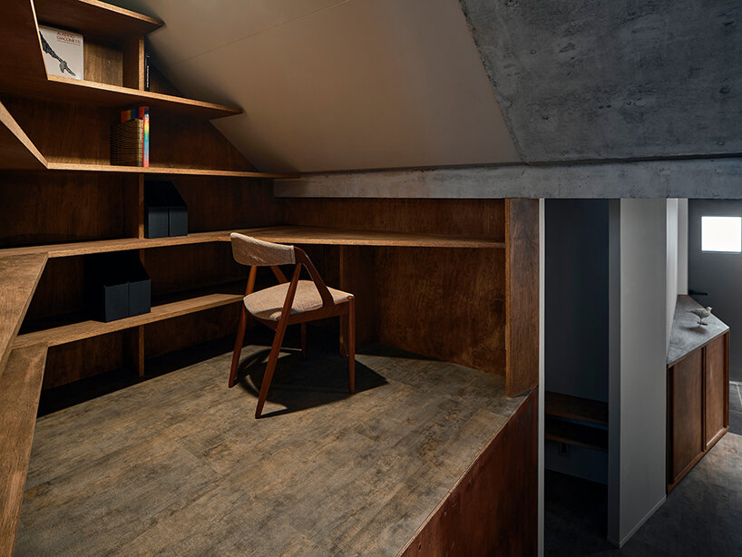 slanted lines and staggered floors create alternative spaces inside tokyo's diagonal house