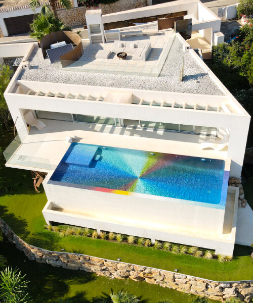 felipe pantone pixelates residential swimming pool with 130,000 rainbow glass mosaics