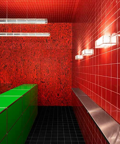 glossy red tiles contrast with lime green counter within spazio maiocchi's new bar in milan