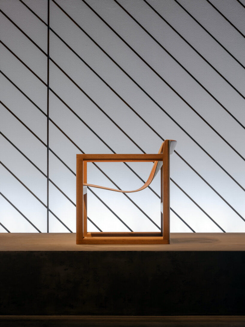 interview: Hermès encloses new home collections in transparent iron rod  installation in milan