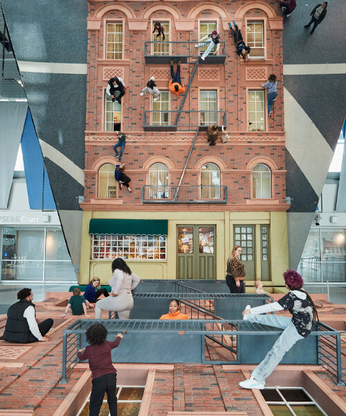 leandro erlich's surreal installation in new jersey invites you to climb + explore a brick façade
