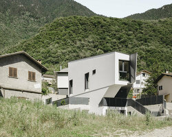 LOKOMOTIV.archs perches a tiny triangular house along a swiss hillside
