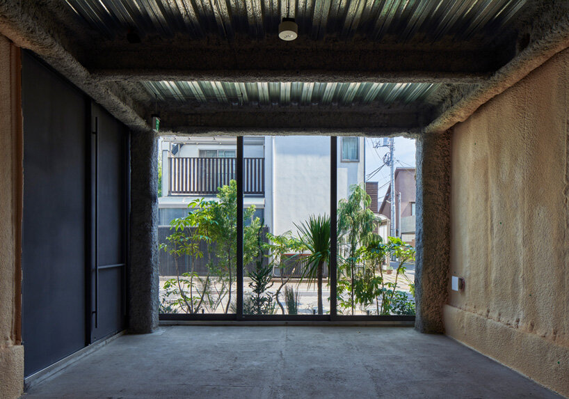 o_building wraps in half-mirrors and nature-infused pathway to open up tokyo urbanscape
