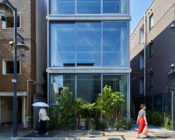 o_building wraps in half-mirrors and nature-infused pathway to open up tokyo urbanscape