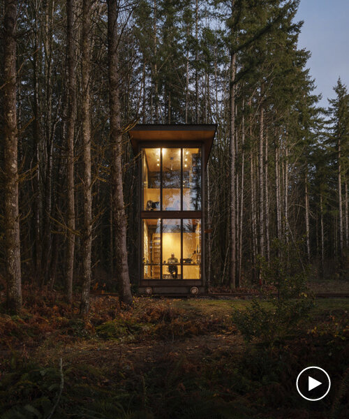 olson kundig architects' mobile 'maxon studio' rolls into the forest on railroad tracks