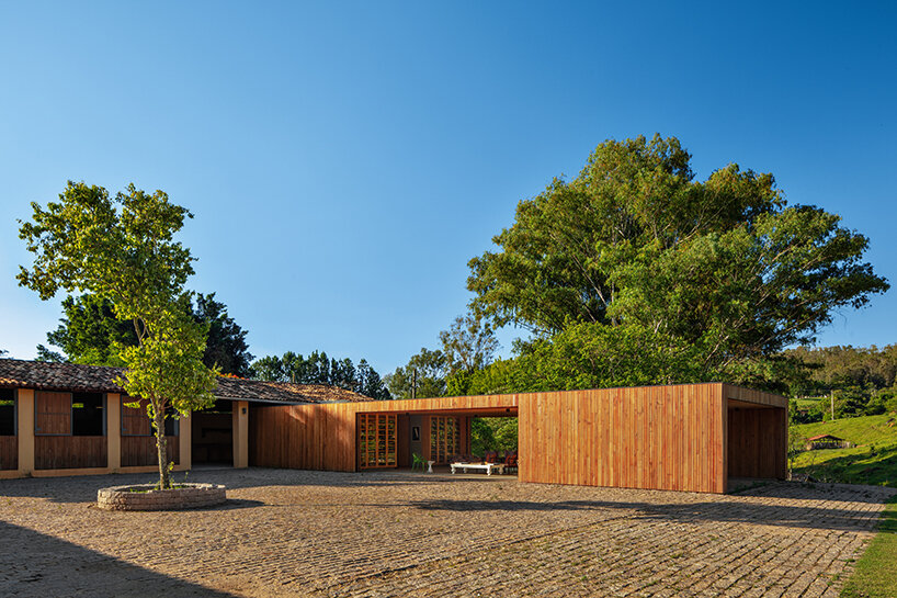 terra capobianco's wooden pavilion frames contemplative views of the brazilian farmscape