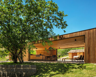 terra capobianco's wooden pavilion frames contemplative views of the brazilian farmscape