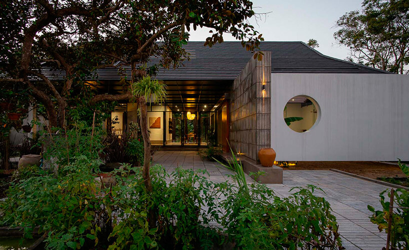 cement blocks and iron lattice enclose private courtyard in rural vietnam