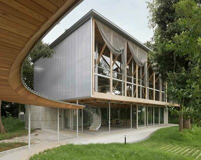 lightweight structure of wooden trusses builds up tsubame architects' annex in japan