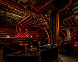 bangkok bar disguised as pawnshop indulges visitors in ambient lighting and sculptural loops