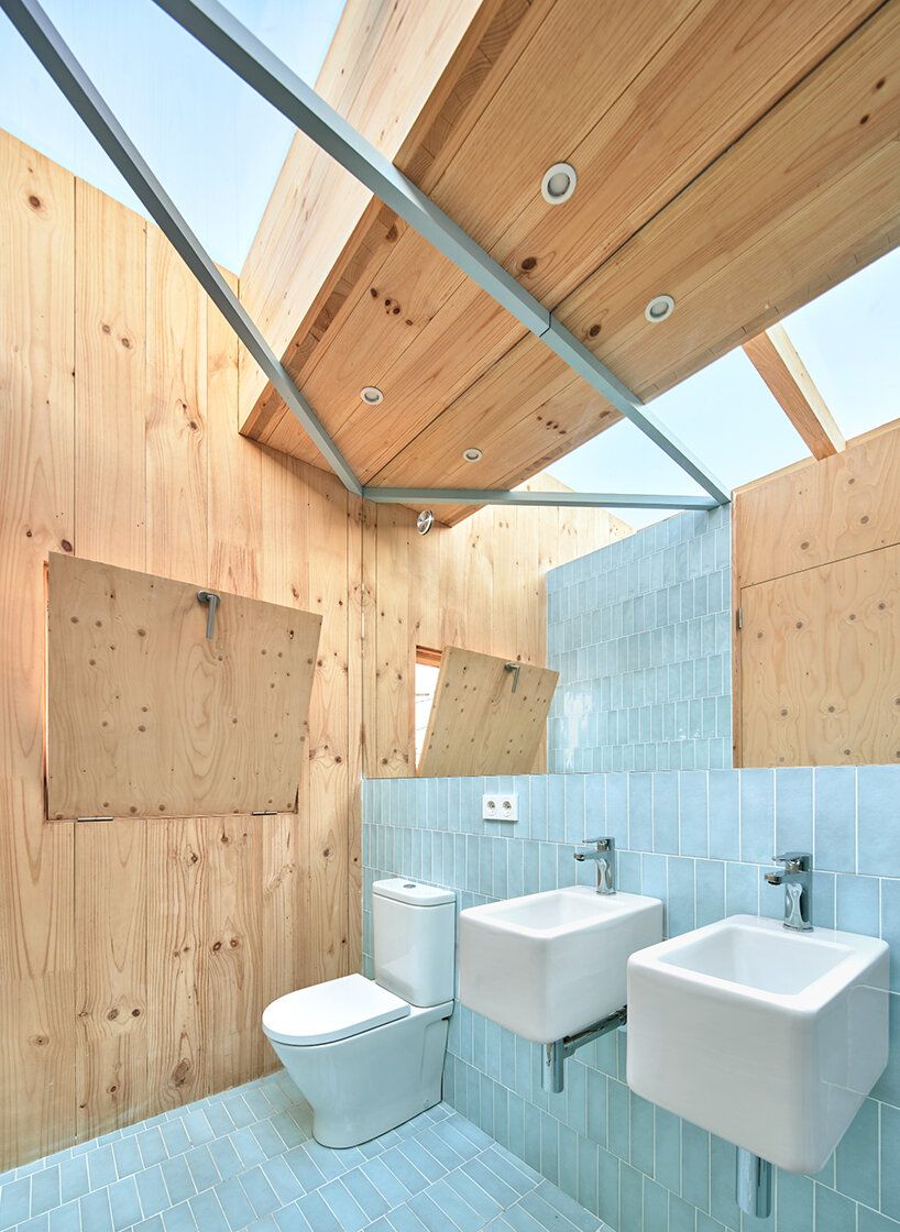 ágora arquitectura stacks cross laminated timber house atop old brick base in spain
