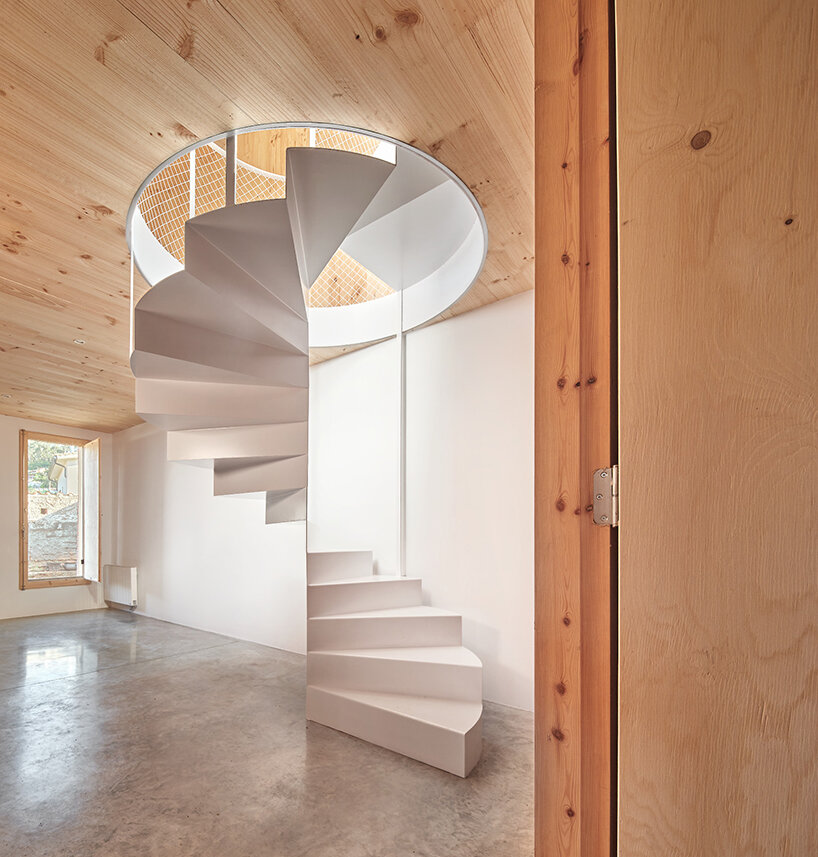 ágora arquitectura stacks cross laminated timber house atop old brick base in spain