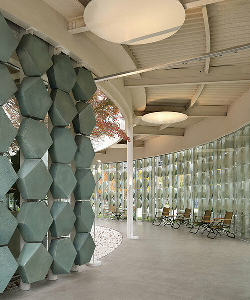 studio8 wraps a spiraling shanghai café with green porcelain tiles
