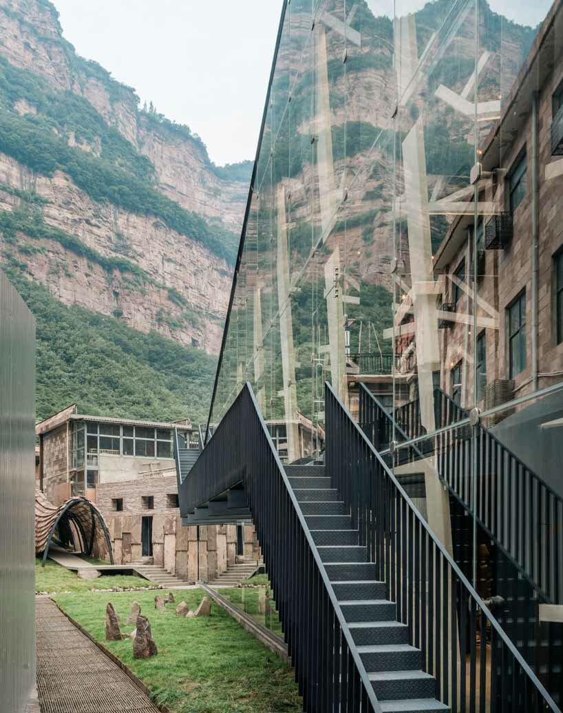 this art museum organically grows out of its rough terrain in china