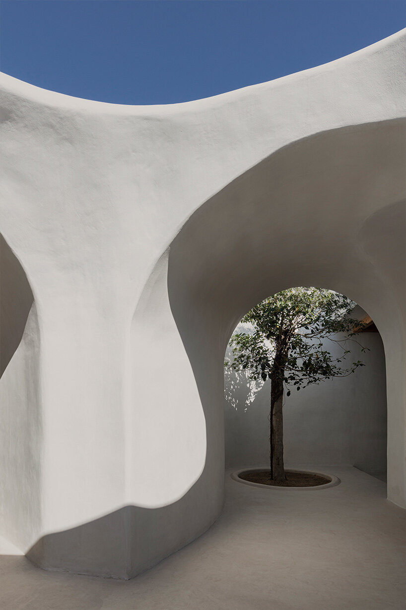 omniview's mykonian summer venue nods to cycladic interiors through organic forms and nooks