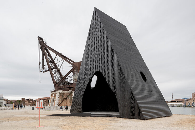 david adjaye's triangular all-timber pavilion pierces the sky at venice architecture biennale