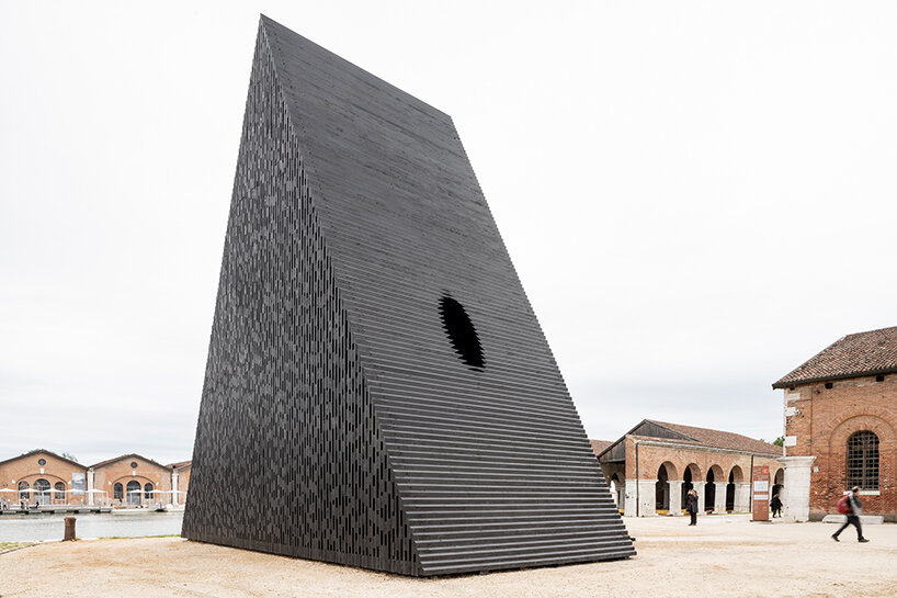 david adjaye's triangular all-timber pavilion pierces the sky at venice architecture biennale