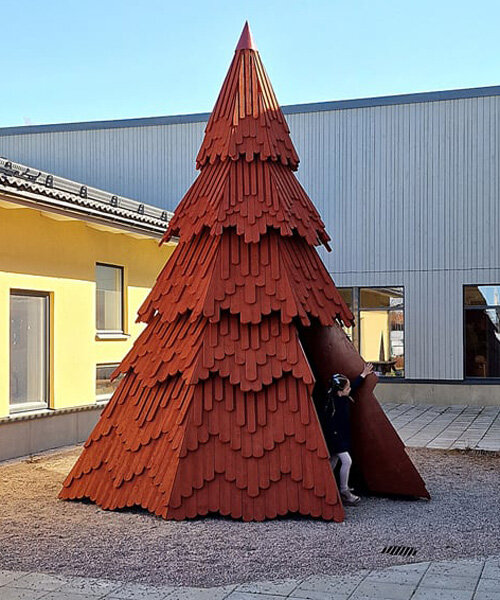UMA nestles children's library inside spruce tree-shaped installation in sweden