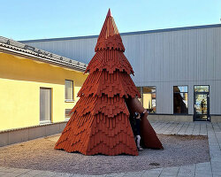 UMA nestles children's library inside spruce tree-shaped installation in sweden
