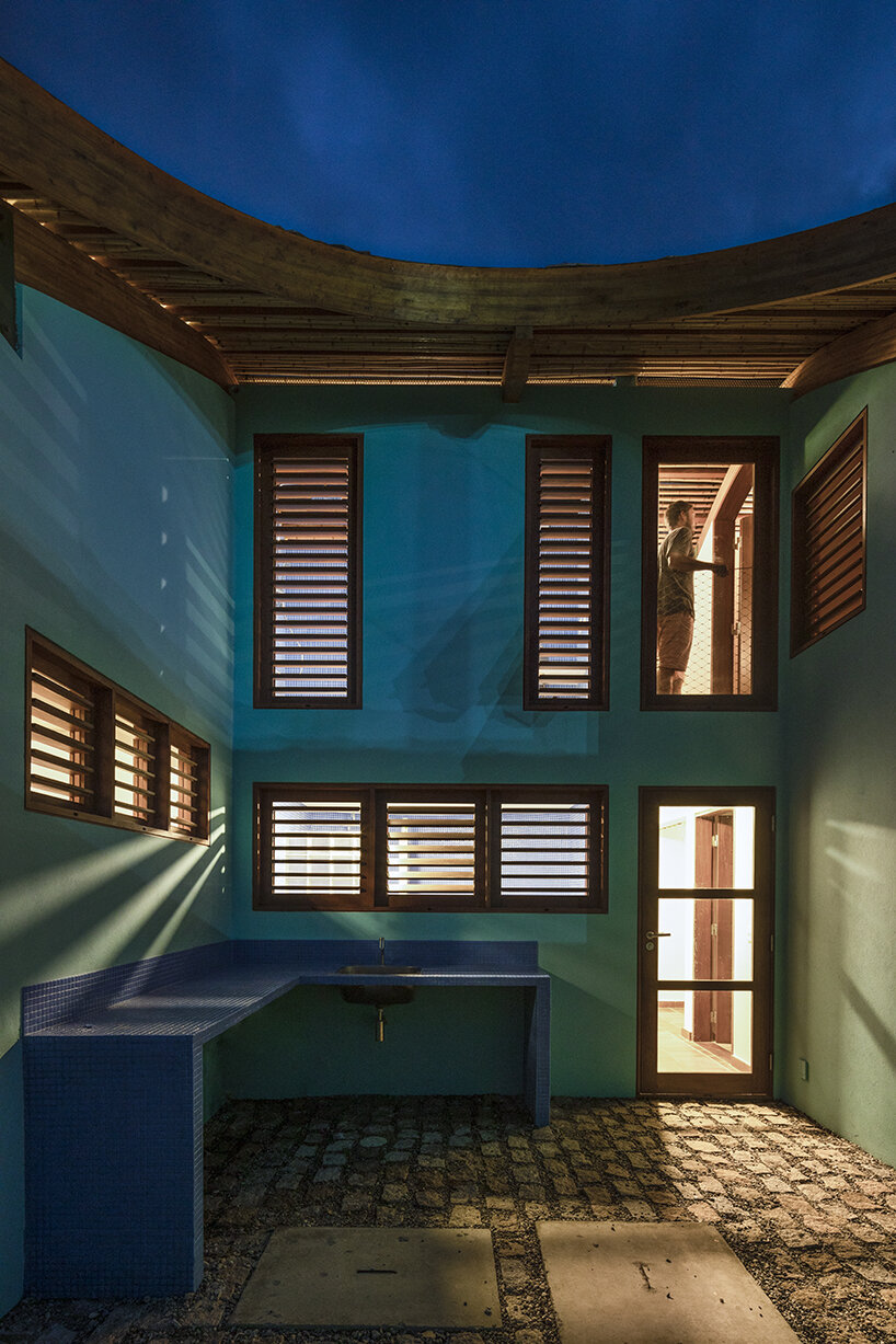 built as an inverted ship, 'gutter house' by daniel florez honors brazil's past sailor-architects