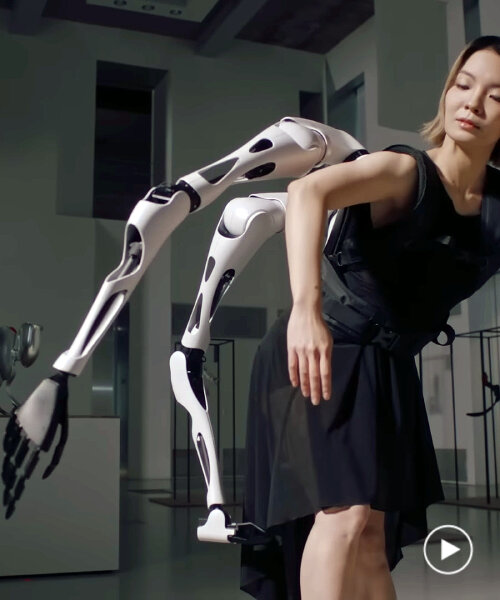 wearable robot arms that move like spider legs prepare human interaction with cyborgs