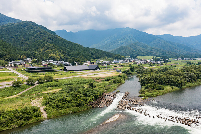 furuya design weaves underground sake brewery into the lush landscape of fukui, japan