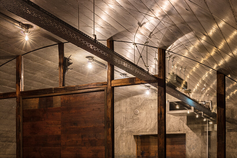 furuya design weaves underground sake brewery into the lush landscape of fukui, japan