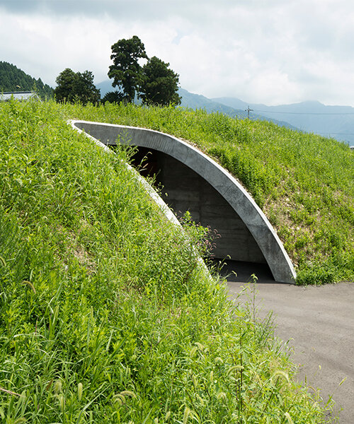 furuya design weaves underground sake brewery into the lush landscape of fukui, japan