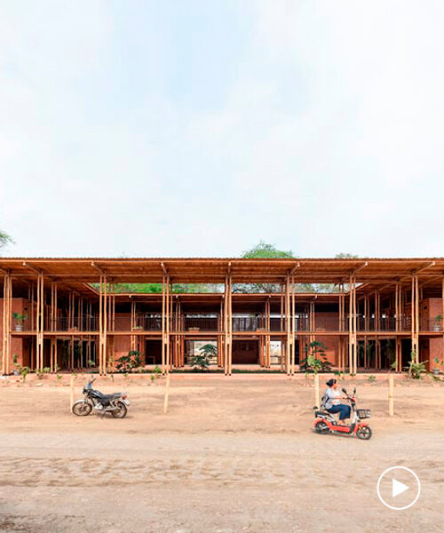 round teak wooden posts uphold natura futura's community center in ecuador