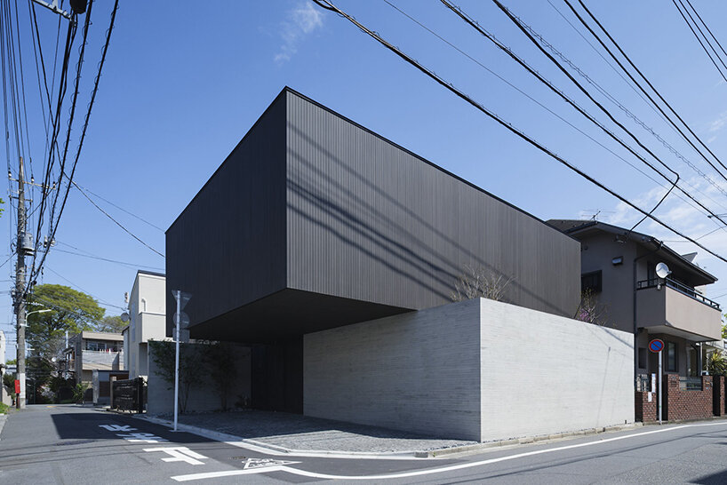 stacked lumber + concrete shape apollo architects' 'LAXUS' house