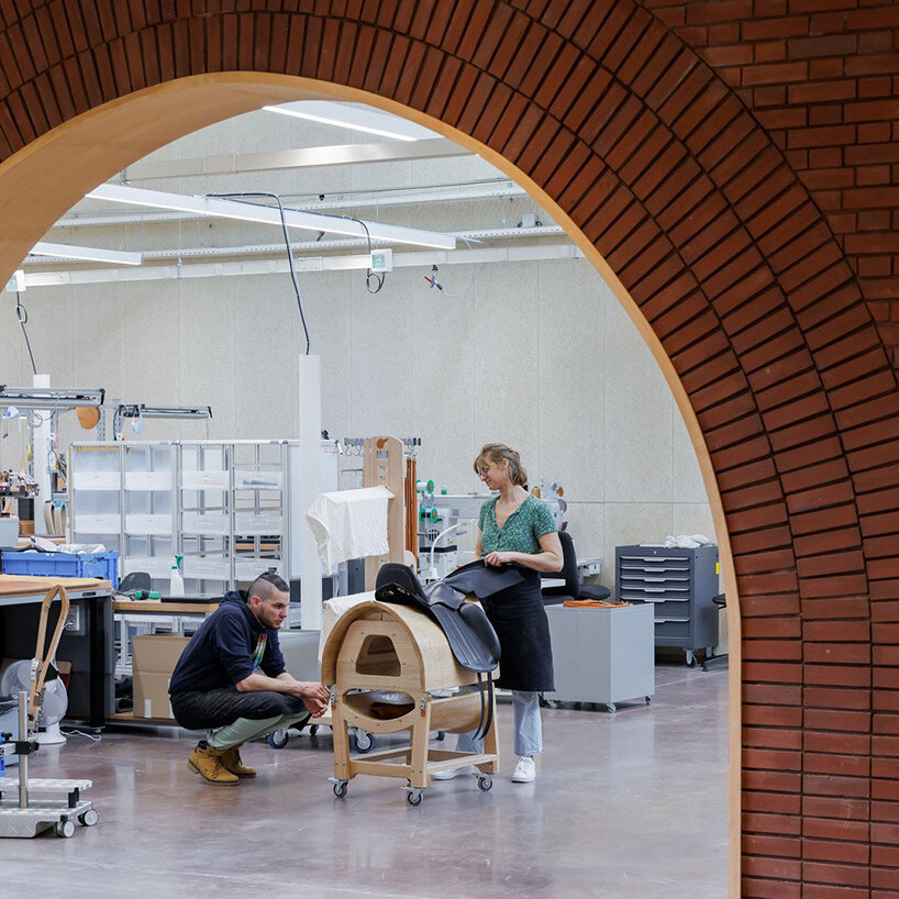 lina ghotmeh brings sweeping arches to brick-clad hermès workshop in normandy