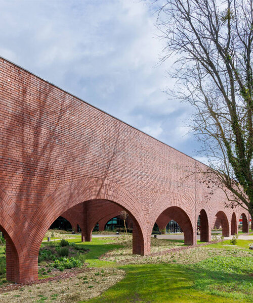 lina ghotmeh brings sweeping arches to Hermès workshop in normandy