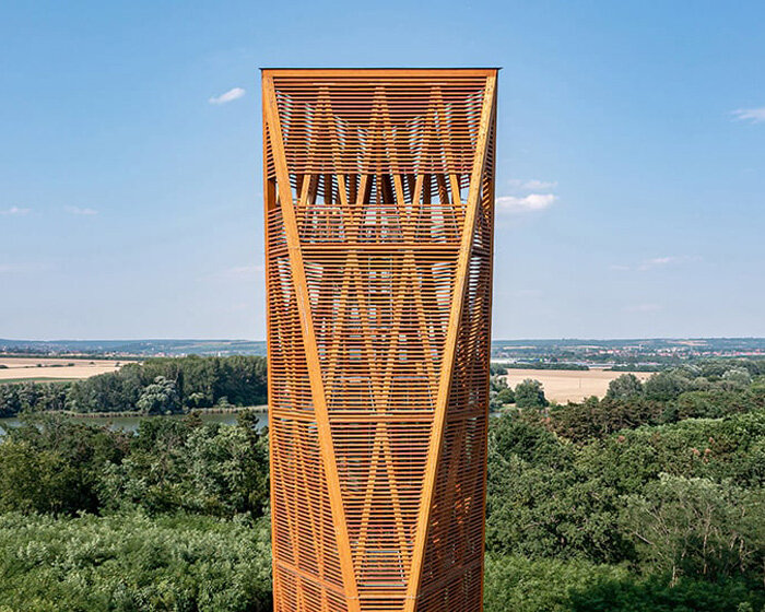 winding timber lookout tower rises above budapest's nature reserve for 360-degree vistas
