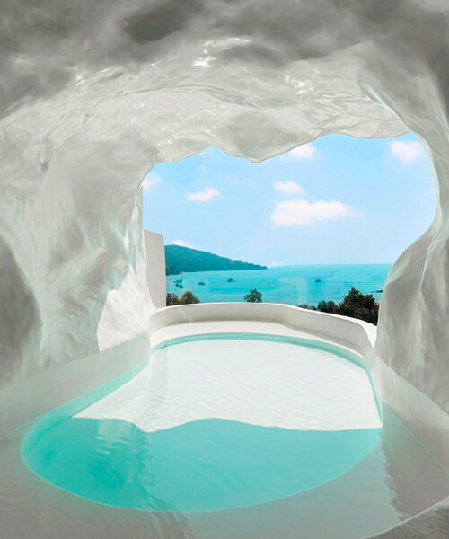 cliffside resort's white caves and arches frame the views of chinese south coast