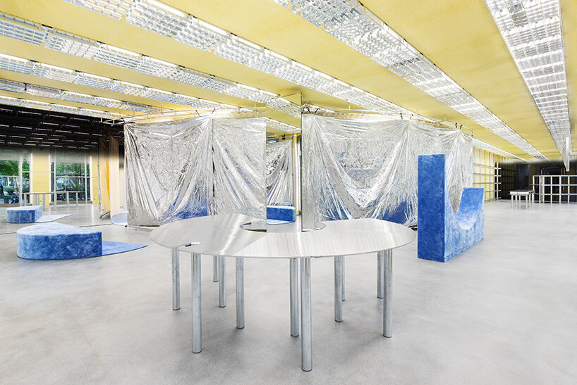 metallic meets vibrant blue inside modes milan's store design by gonzalez haase AAS